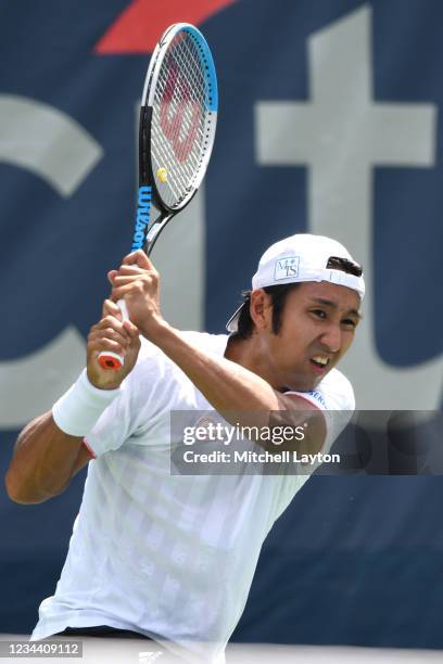 Yasutaka Uchiyama of Japan returns a shot during a match against Andreas Seppi of Italy on Day 3 during the Citi Open at Rock Creek Tennis Center on...