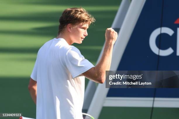 Jenson Booksby of the United States celebrates a win against Kevin Anderson of South Africa on Day 3 during the Citi Open at Rock Creek Tennis Center...