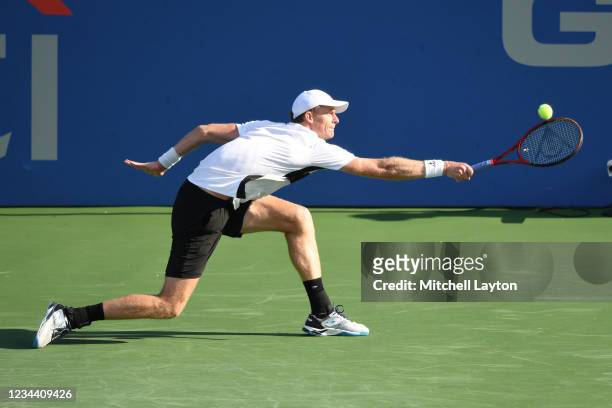Kevin Anderson of South Africa lunges for a return against Jenson Booksby of the United State on Day 3 during the Citi Open at Rock Creek Tennis...