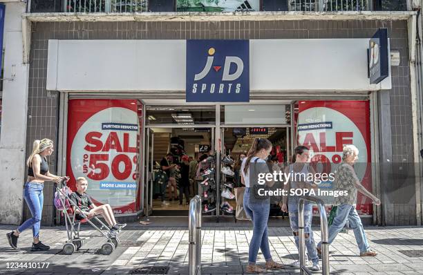 Shoppers walk past JD Sports Store in Donegall Place, Belfast.