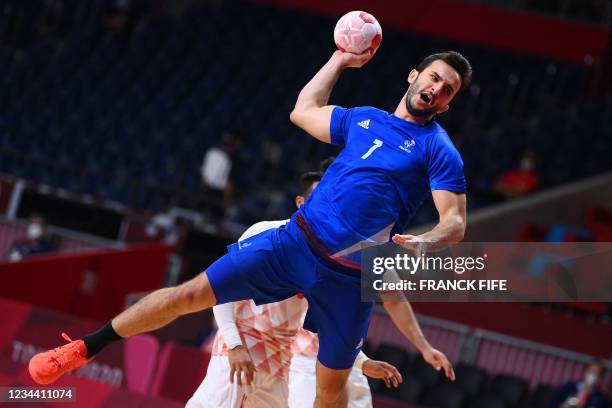 France's left back Romain Lagarde shoots during the men's quarterfinal handball match between France and Bahrain of the Tokyo 2020 Olympic Games at...