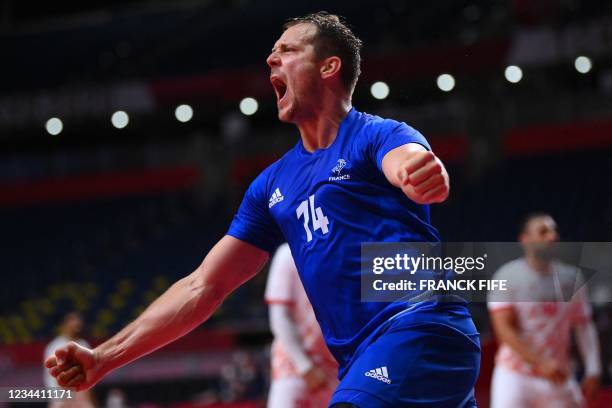 France's centre back Kentin Mahe celebrates after scoring during the men's quarterfinal handball match between France and Bahrain of the Tokyo 2020...