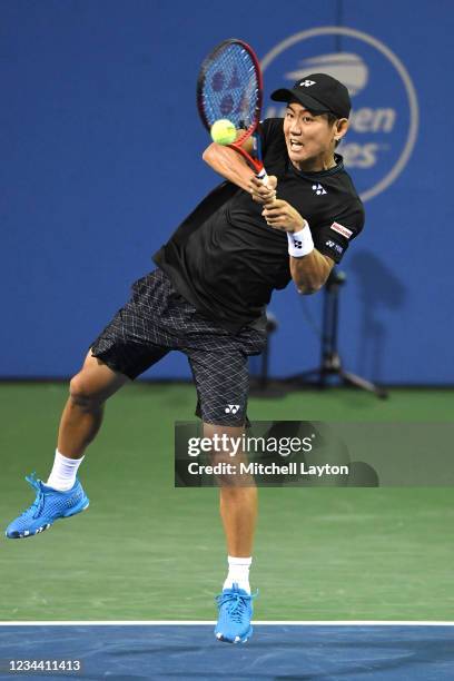 Yoshihito Nishioka of Japan returns a shot against Jack Sock of the United States on Day 3 of the Citi Open at Rock Creek Tennis Center on August 2,...