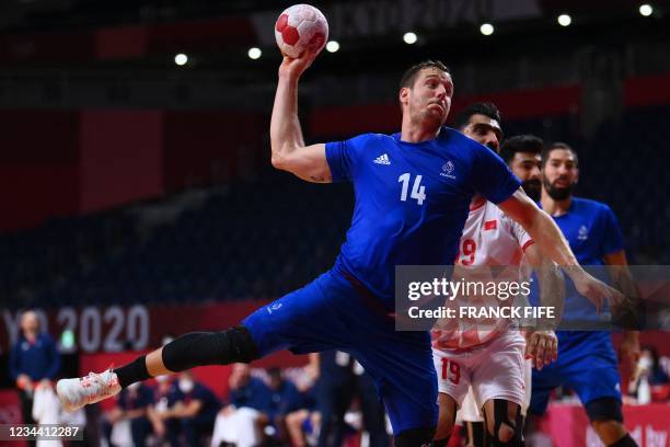 France's centre back Kentin Mahe shoots during the men's quarterfinal handball match between France and Bahrain of the Tokyo 2020 Olympic Games at...