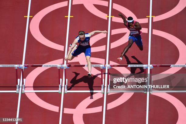 An overview shows Norway's Karsten Warholm and USA's Rai Benjamin as they compete in the men's 400m hurdles final during the Tokyo 2020 Olympic Games...