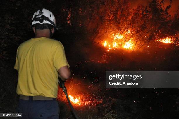 Smoke and flames rise during a forest fire in Kocani, in the eastern part of North Macedonia on August 03, 2021.