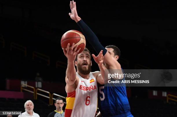 Spain's Sergio Rodriguez goes to the basket past USA's Zachary Lavine in the men's quarter-final basketball match between Spain and USA during the...