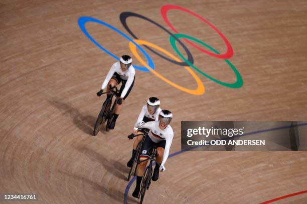 Germany's Lisa Brennauer celebrates after set a new world record in the first round heats of the women's track cycling team pursuit event during the...