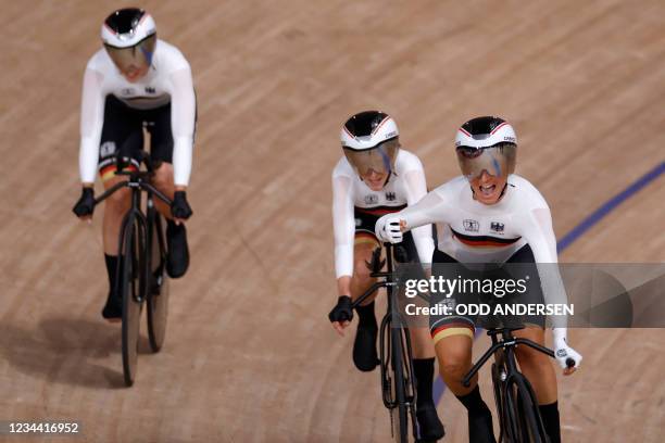 Germany's Lisa Brennauer celebrates after set a new world record in the first round heats of the women's track cycling team pursuit event during the...