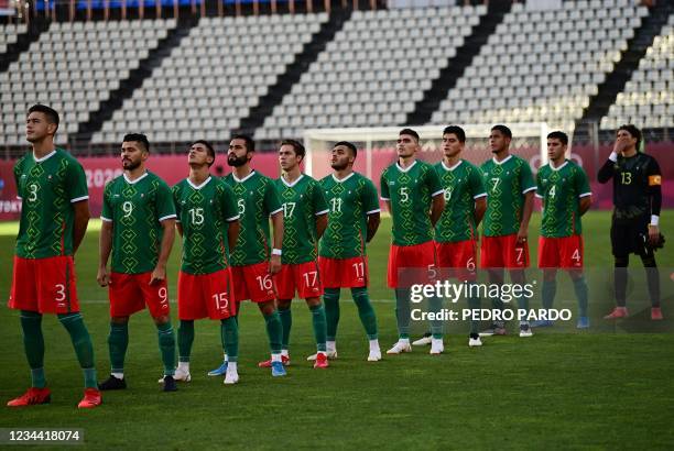 Mexico's starting eleven listen to their national anthem ahead of the Tokyo 2020 Olympic Games men's semi-final football match between Mexico and...