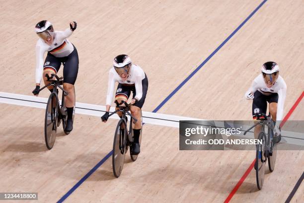 Germany's team celebrates as they setting the new world record during the women's track cycling team pursuit finals during the Tokyo 2020 Olympic...