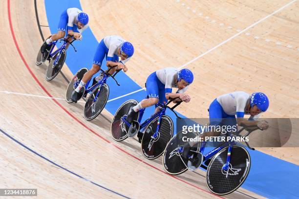 Italy's team compete in the first round heats of the men's track cycling team pursuit during the Tokyo 2020 Olympic Games at Izu Velodrome in Izu,...