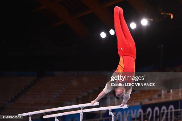 China's Zou Jingyuan competes in the artistic gymnastics men's parallel bars final of the Tokyo 2020 Olympic Games at Ariake Gymnastics Centre in...