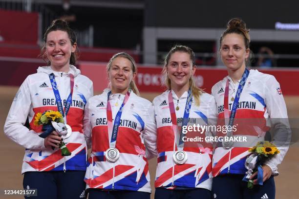 Silver medallist Great Britain's team Katie Archibald, Neah Evans, Laura Kenny and Josie Knight celebrates on podium during the medal ceremony for...