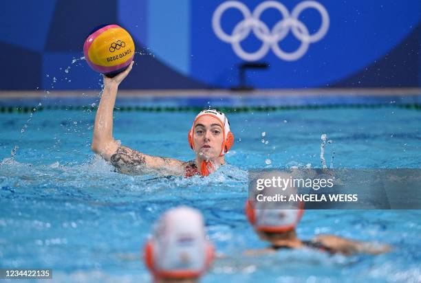 Netherlands' Sabrina Van Der Sloot passes the ball during the Tokyo 2020 Olympic Games women's water polo quarter-final match between the Netherlands...