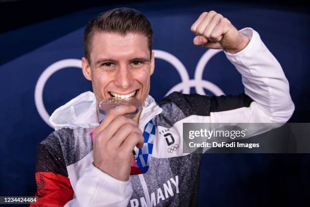 Lukas Dauser of Germany celebrates in the Men's Parallel Bars Final Artistic Gymnastics Competition on day eleven of the Tokyo 2020 Olympic Games at...
