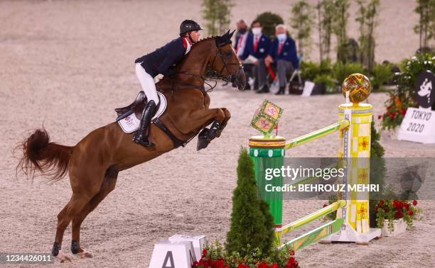 Britain's Ben Maher rides Explosion W in the equestrian's jumping individual qualifying during the Tokyo 2020 Olympic Games at the Equestrian Park in...