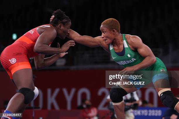 S Tamyra Mariama Mensah-Stock wrestles Nigeria's Blessing Oborududu in their women's freestyle 68kg wrestling final match during the Tokyo 2020...