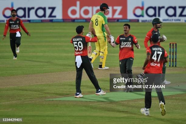 Bangladesh's cricketers celebrate after the dismissal of Australia's Josh Philippe during first Twenty20 international cricket match between...
