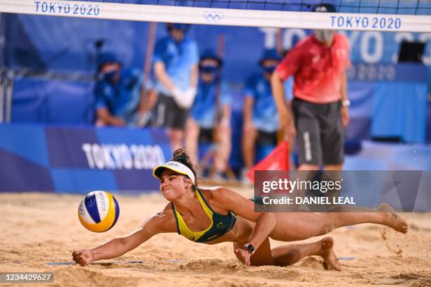Australia's Mariafe Artacho del Solar reaches for the ball in their women's beach volleyball quarter-final match between Canada and Australia during...