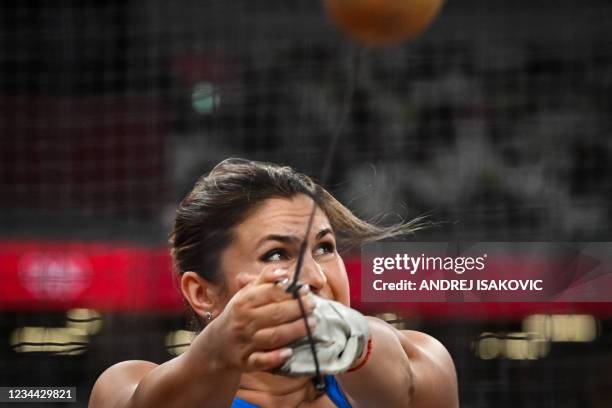 Romania's Bianca Florentina Ghelber competes in the women's hammer throw final during the Tokyo 2020 Olympic Games at the Olympic Stadium in Tokyo on...