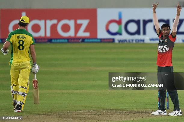 Bangladesh's Nasum Ahmed celebrates after the dismissal of Australia's Mitchell Marsh during first Twenty20 international cricket match between...