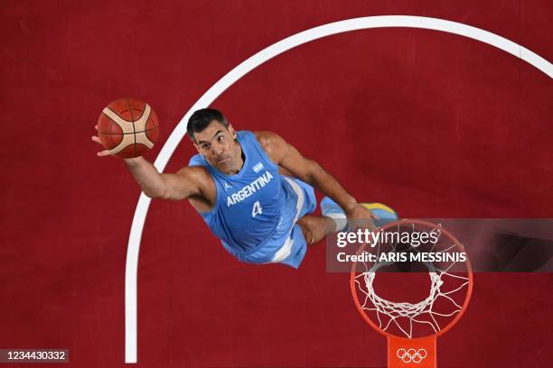 Argentina's Luis Scola jumps for a rebound in the men's quarter-final basketball match between Australia and Argentina during the Tokyo 2020 Olympic...