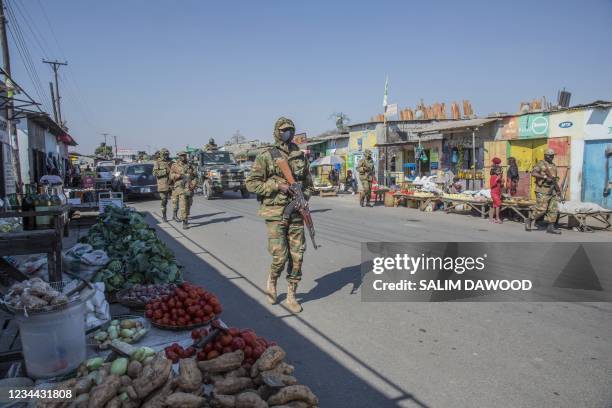 Zambian Army soldiers patrol the Chawama Compound in Lusaka on August 3, 2021 after President Edar Lungu oredered the army to help police curb...