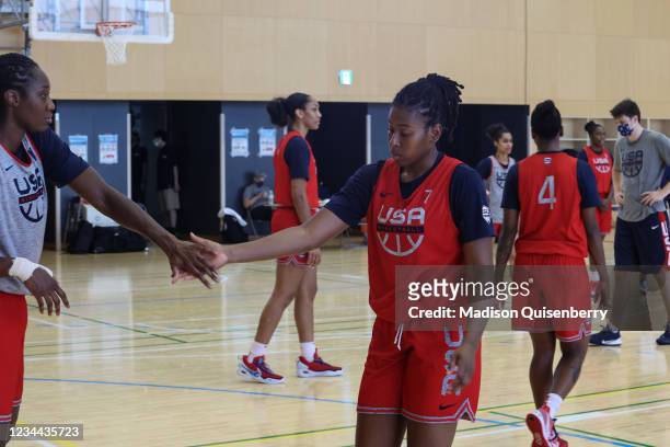 Ariel Atkins of the USA Women's National Team high fives Tina Charles during USAB Womens National Team practice on August 3, 2021 in Tokyo, Japan....