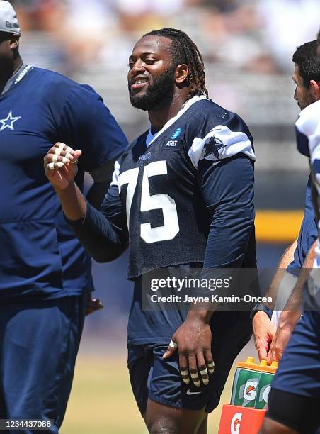 Defensive tackle Osa Odighizuwa of the Dallas Cowboys participates in drills during training camp at River Ridge Complex on August 3, 2021 in Oxnard,...