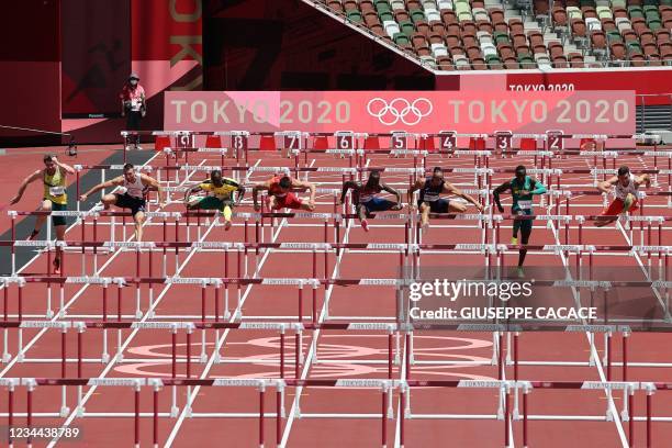 Jamaica's Ronald Levy wins the men's 110m hurdles semi-final during the Tokyo 2020 Olympic Games at the Olympic Stadium in Tokyo on August 4, 2021.