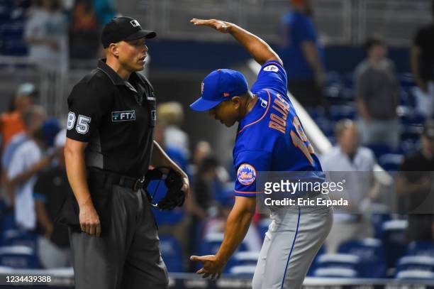Manager Luis Rojas of the New York Mets argues with home plate umpire Stu Scheurwater after being ejected in the seventh inning of the game against...