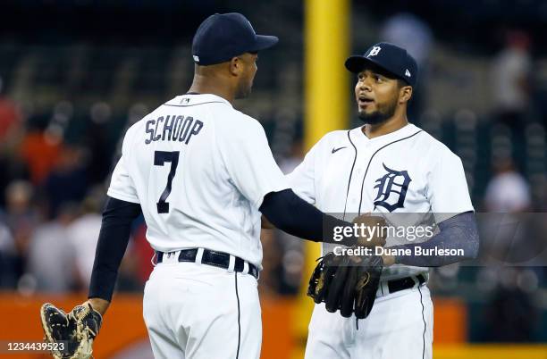 Jeimer Candelario of the Detroit Tigers celebrates with Jonathan Schoop after a 4-2 win over the Boston Red Sox at Comerica Park on August 3 in...