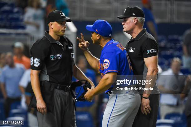 Manager Luis Rojas of the New York Mets argues with home plate umpire Stu Scheurwater after being ejected in the seventh inning of the game against...