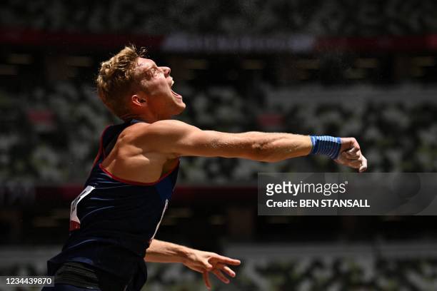 France's Kevin Mayer competes in the men's decathlon shot put during the Tokyo 2020 Olympic Games at the Olympic Stadium in Tokyo on August 4, 2021.