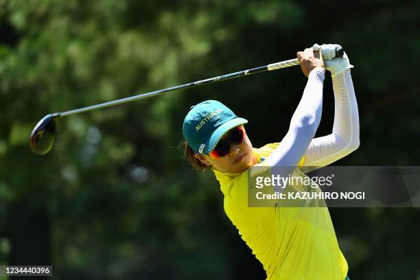 Australia's Minjee Lee watches her drive from the 9th tee in round 1 of the womens golf individual stroke play during the Tokyo 2020 Olympic Games at...
