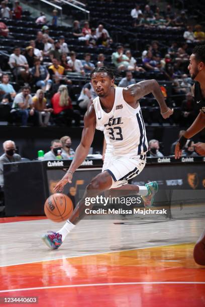 Elijah Hughes of the Utah Jazz White dribbles the ball against the San Antonio Spurs during the 2021 Salt Lake City Summer League on August 3, 2021...