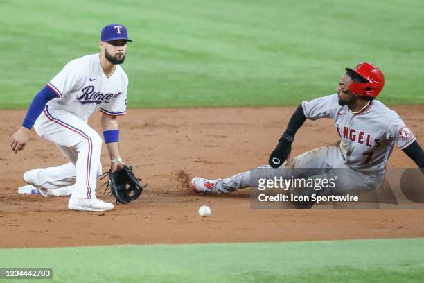 Los Angeles Angels center fielder Jo Adell slides into second base as Texas Rangers third baseman Isiah Kiner-Falefa fields the baseball during the...