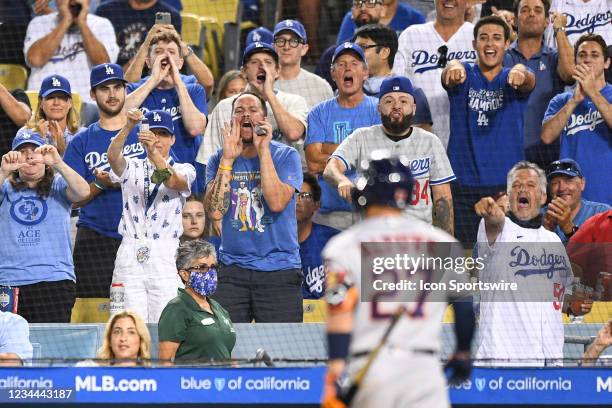 Dodger fans yell at Houston Astros second baseman Jose Altuve as he walks to the dugout after he struck out during the MLB game between the Houston...