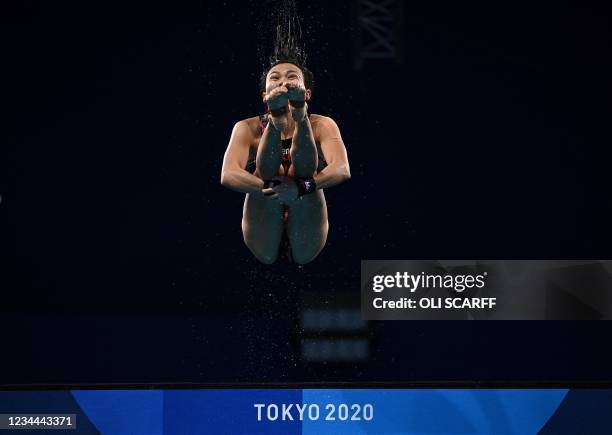 Malaysia's Jun Hoong Cheong competes in the preliminary round of the women's 10m platform diving event during the Tokyo 2020 Olympic Games at the...