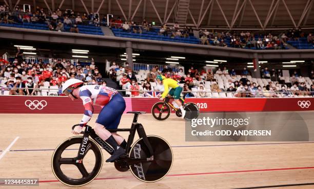 Britain's Jack Carlin and Australia's Nathan Hart compete in a heat of the men's track cycling sprint 1/32 finals during the Tokyo 2020 Olympic Games...