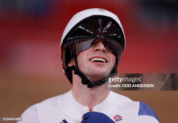 Britain's Jason Kenny reacts after winning a heat of the men's track cycling sprint 1/32 finals during the Tokyo 2020 Olympic Games at Izu Velodrome...