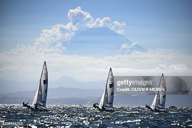 Japan's Ai Yoshida and Miho Yoshioka, Britain's Hannah Mills and Eilidh Mcintyre and France's Aloise Retornaz and France's Camille Lecointre sail...