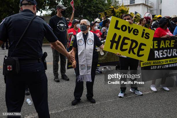 Faith leader is arrested by the US Capitol Police. The Poor People's Campaign rallied and marched in Washington DC, where faith leaders, low-wage...