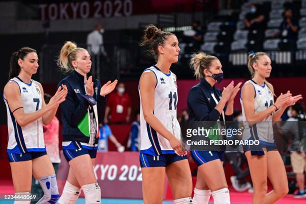 Italy's players applaud after defeat in the women's quarter-final volleyball match between Serbia and Italy during the Tokyo 2020 Olympic Games at...