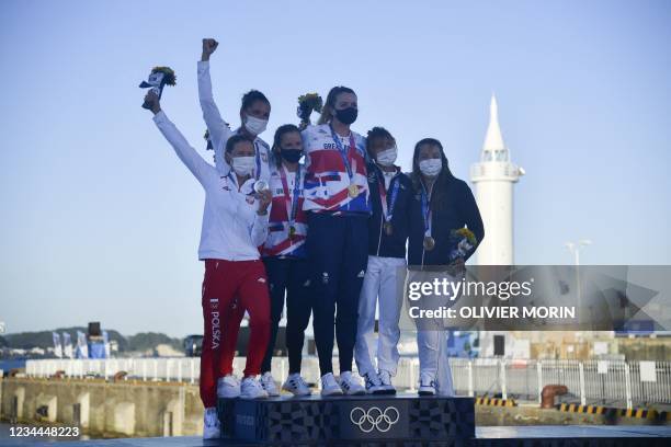 Silver medallists Poland's Agnieszka Skrzypulec and Jolanta Ogar, gold medallists Britain's Hannah Mills and Eilidh Mcintyre, and bronze medallists...