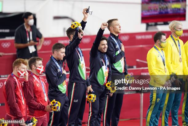 Simone Consonni, Flippo Ganna, Francesco Lamon and Jonathan Milan of Italy collect their gold for the Men's Team Pursuit during the Track Cycling at...