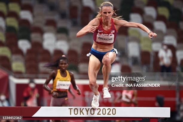 S Courtney Frerichs and Uganda's Peruth Chemutai compete in the women's 3000m steeplechase final during the Tokyo 2020 Olympic Games at the Olympic...