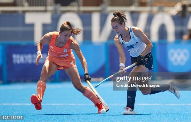 Marloes Keetels of Netherlands and Sarah Robertson of Great Britain battle for the ball in the Women's Semifinal Hockey match between Netherlands and...