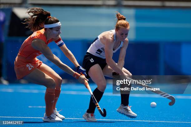 Eva de Goede of Netherlands and Sarah Jones of Great Britain battle for the ball in the Women's Semifinal Hockey match between Netherlands and Great...